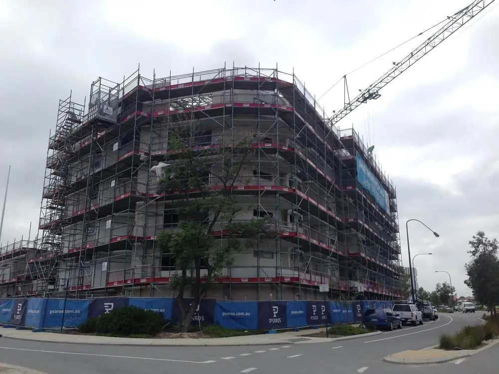 Apartment building fully scaffolded before repainting