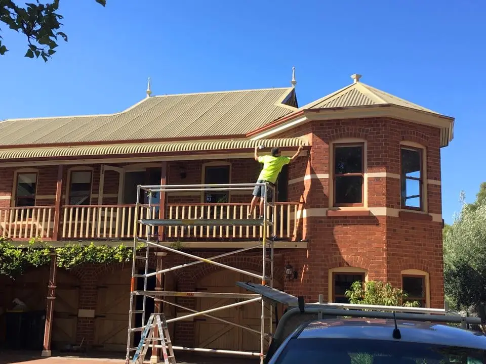 Heritage verandah under scaffold during repainting