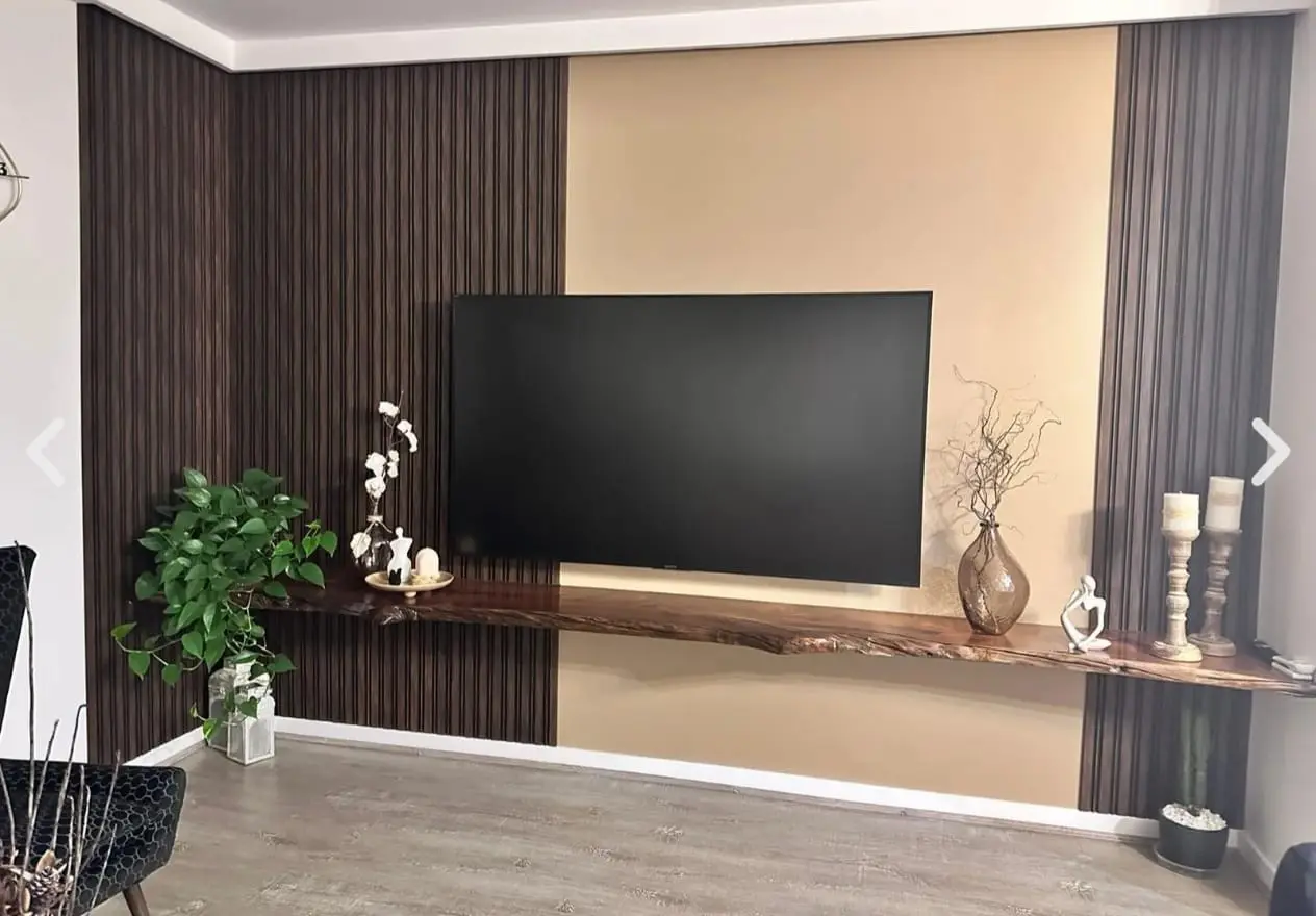 Living room feature wall, timber battens against a warm sand-coloured painted panel