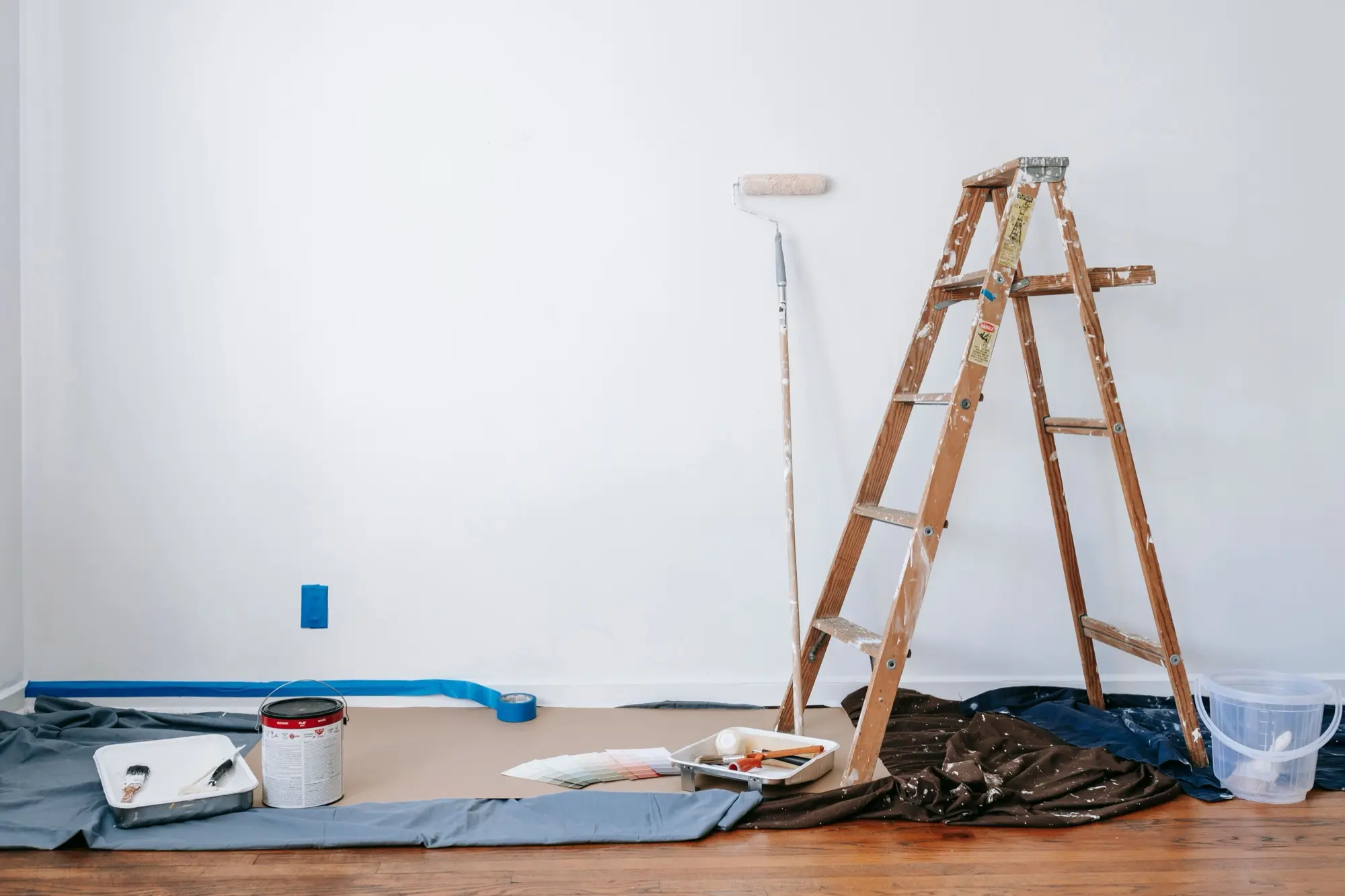 A room prepared and masked before painting in Cambridge Gardens