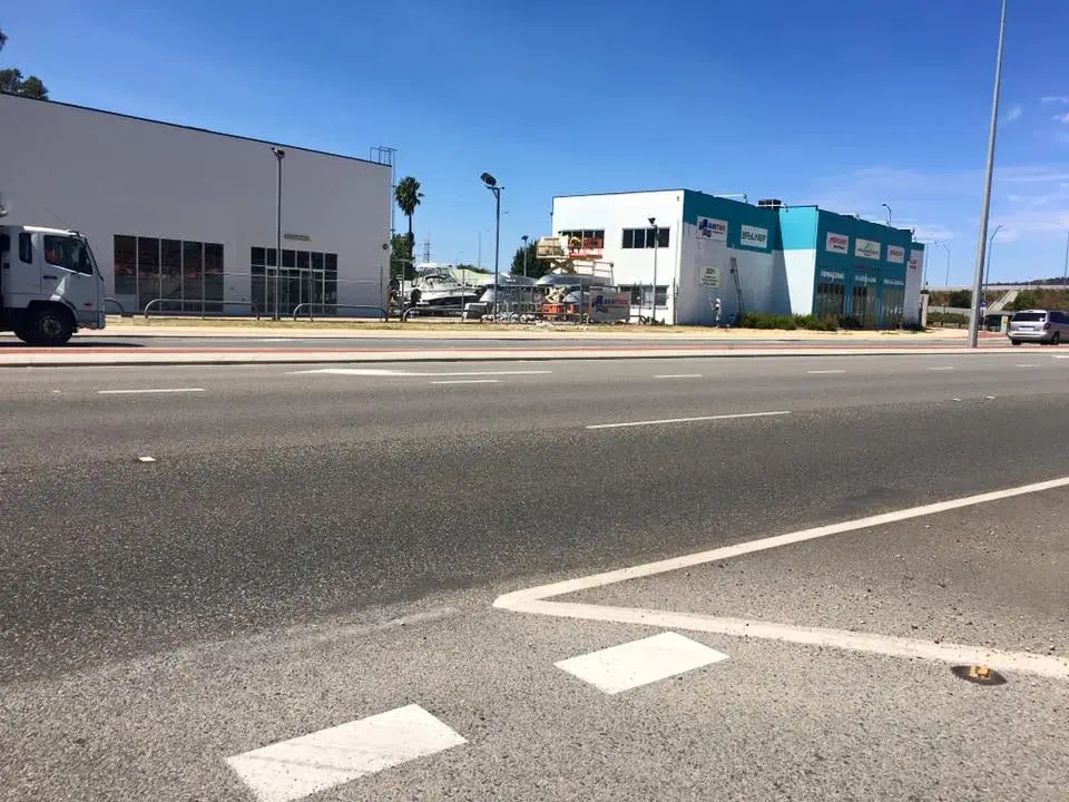 Repainted shopfront strip on a main road